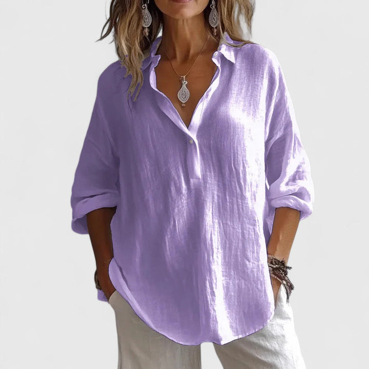 Elegant women's blouse. This stylish long sleeve V-neck top offers comfort & a relaxed fit for versatile wear.