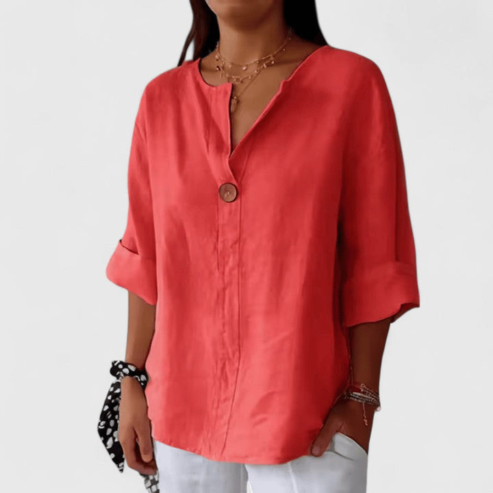 Loose-fit V-neck blouse for women, featuring a stylish front knot. Ideal for casual or elegant occasions.