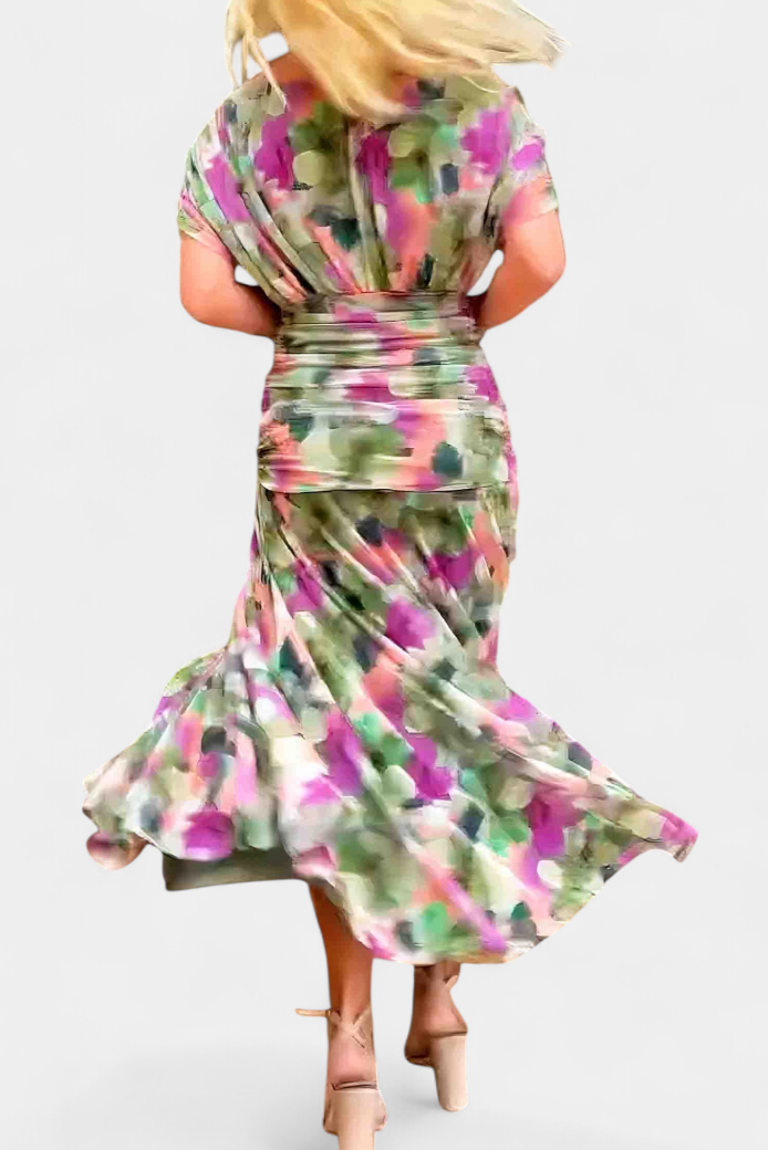 Women's V-neck maxi dress featuring a flattering ruched waist. Elegant long dress for any occasion.