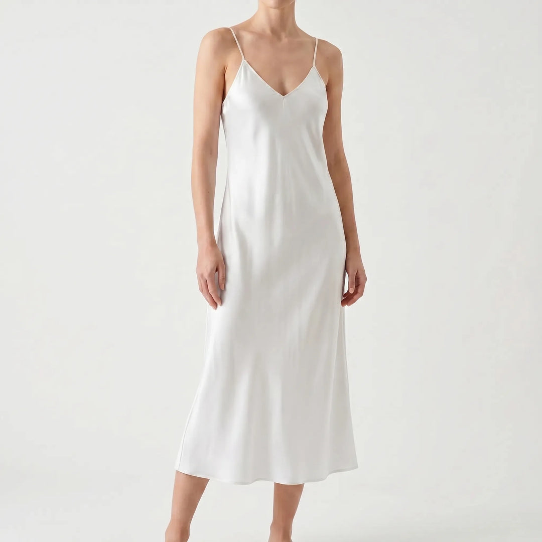 Flowing women's V-neck midi slip dress, elegant & comfortable for summer wear.