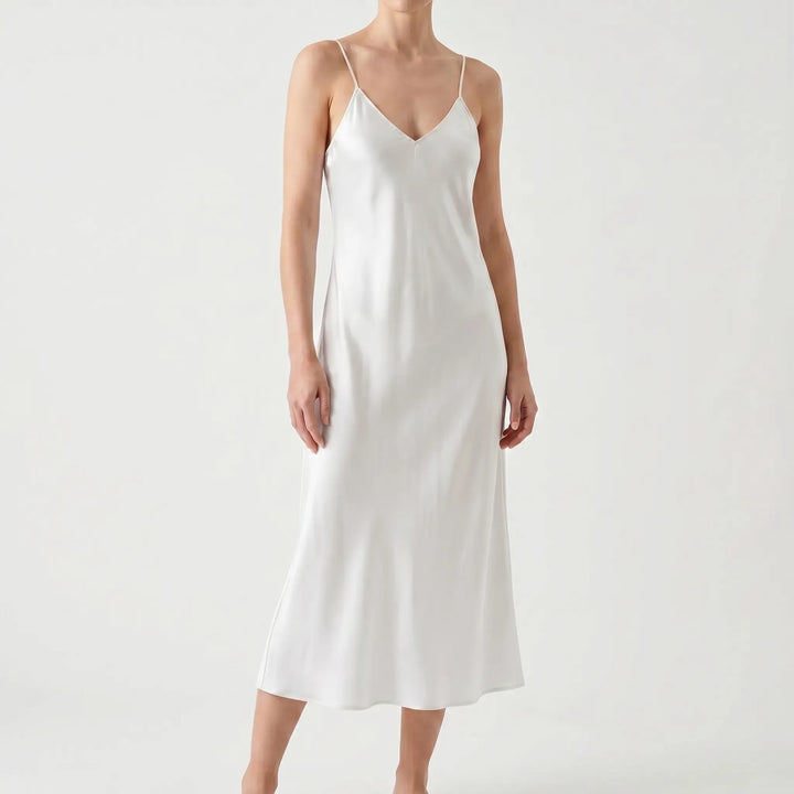 Flowing women's V-neck midi slip dress, elegant & comfortable for summer wear.