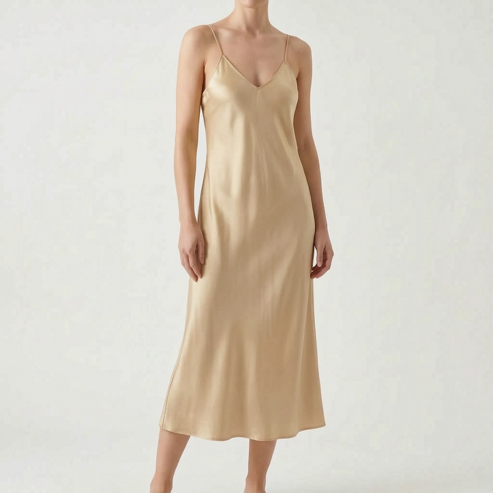 Stylish women's midi slip dress, featuring a V-neck and spaghetti straps, great for day or evening.