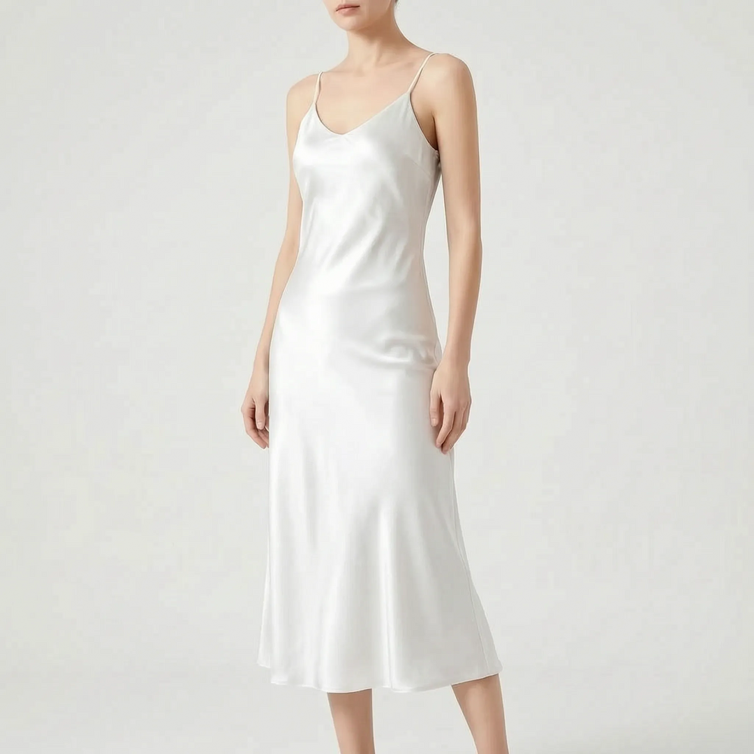Flowing elegant V-neck slip midi dress for women, a comfortable yet chic choice for evening wear or special occasions.