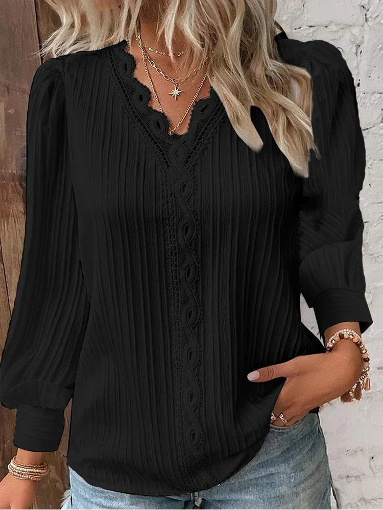 Women's elegant white lace blouse with puff sleeves, perfect for spring/summer fashion.