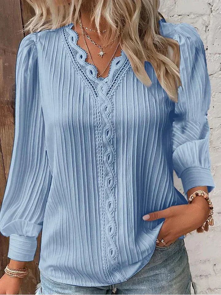 Versatile women's lace top, ideal for casual or dressy elegant outfits. Chiffon-style blouse.