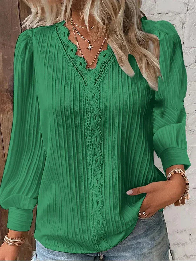 White lace blouse for women, featuring intricate floral lace and elegant puff sleeves. Spring fashion.