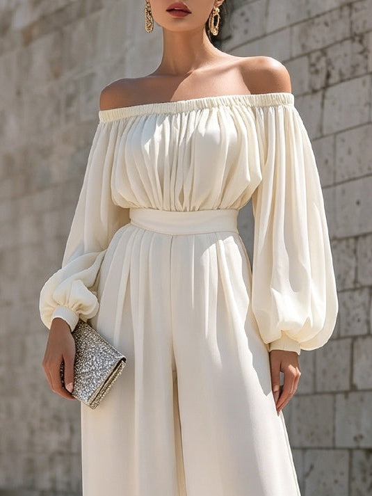 Flattering white off-shoulder maxi dress, elegant and comfortable, with dramatic bishop sleeves.
