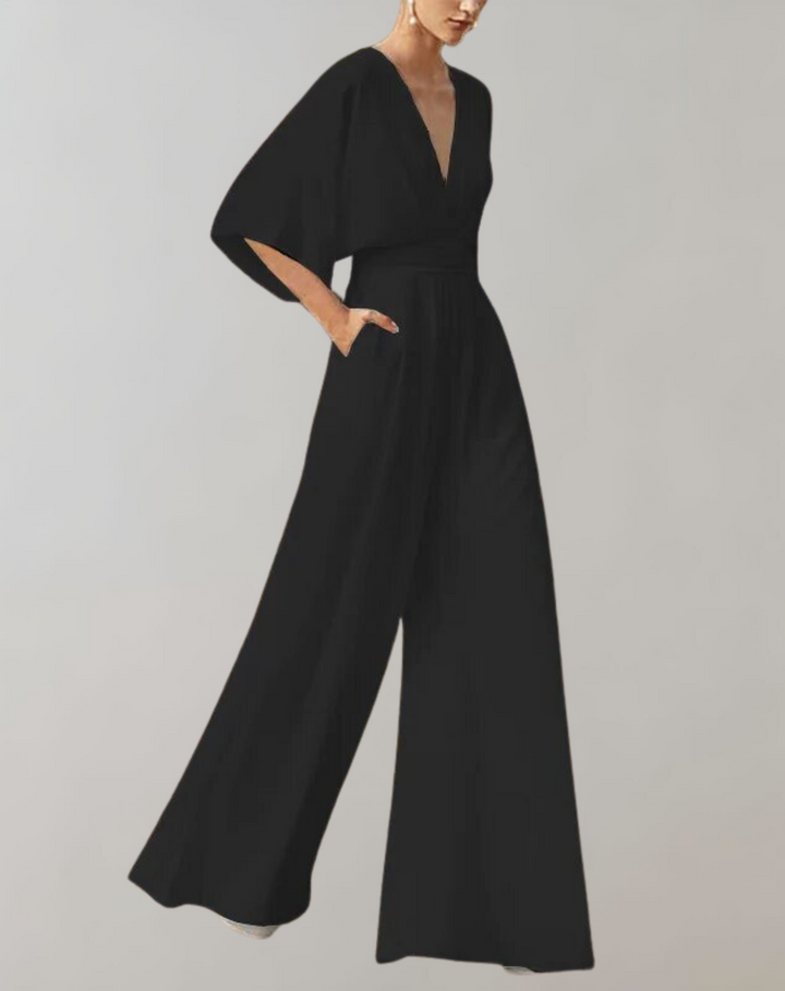 Graceful women's wide leg jumpsuit, flowing design for evening wear. Elegant & stylish party outfit.