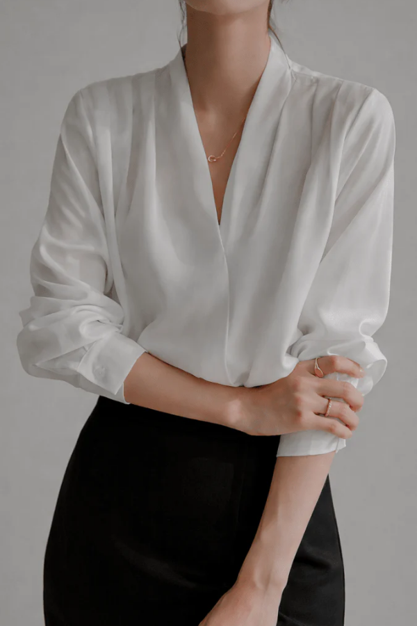 Women's elegant wrap blouse in a refined everyday style. Perfect for workwear & casual chic. Long sleeve top.