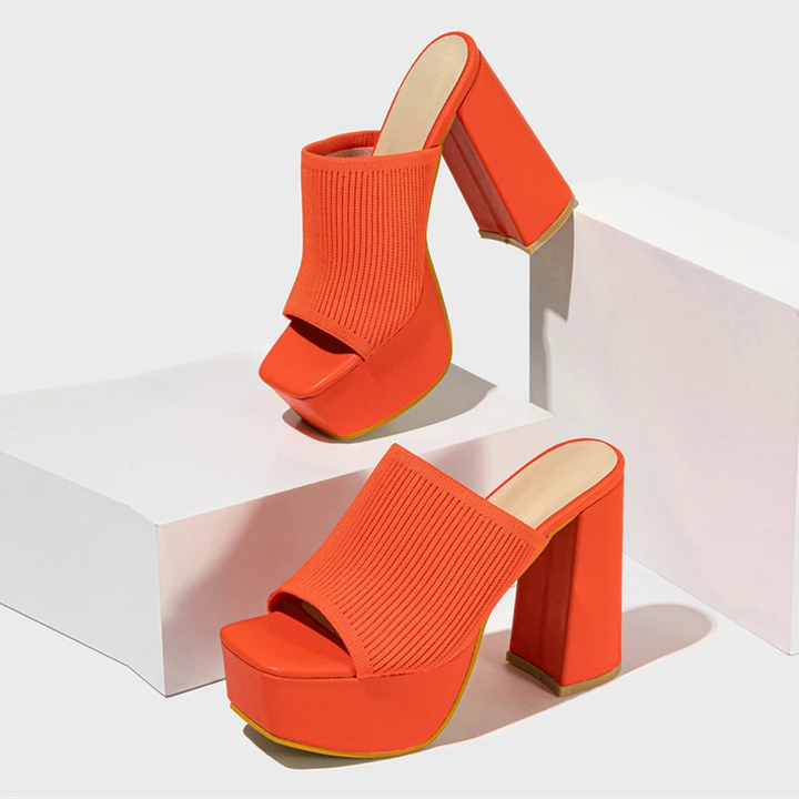 Women's elevated platform sandals, modern open-toe design for stylish comfort and summer fashion.