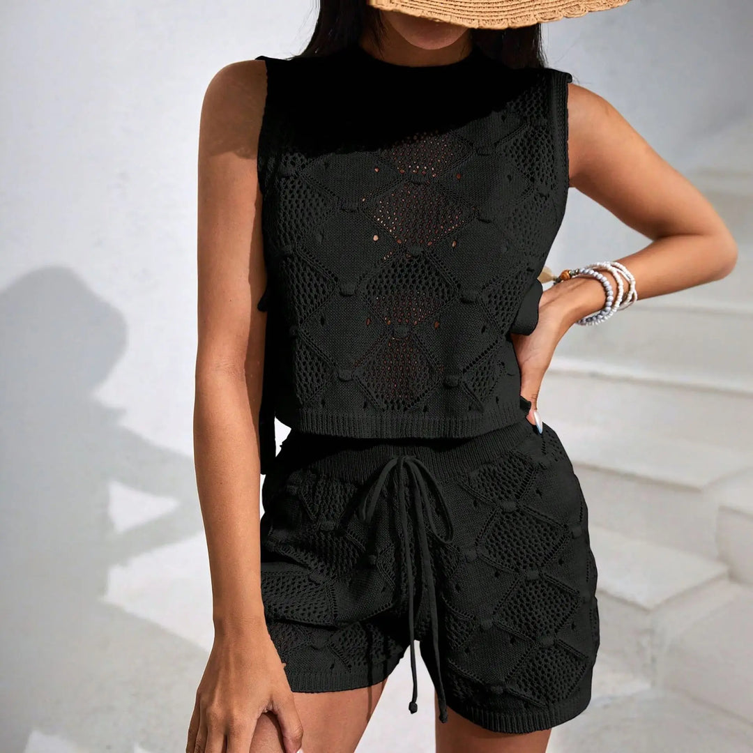 Flat lay of Elira women's crochet two-piece set: sleeveless crop top & high-waist shorts for summer fashion.