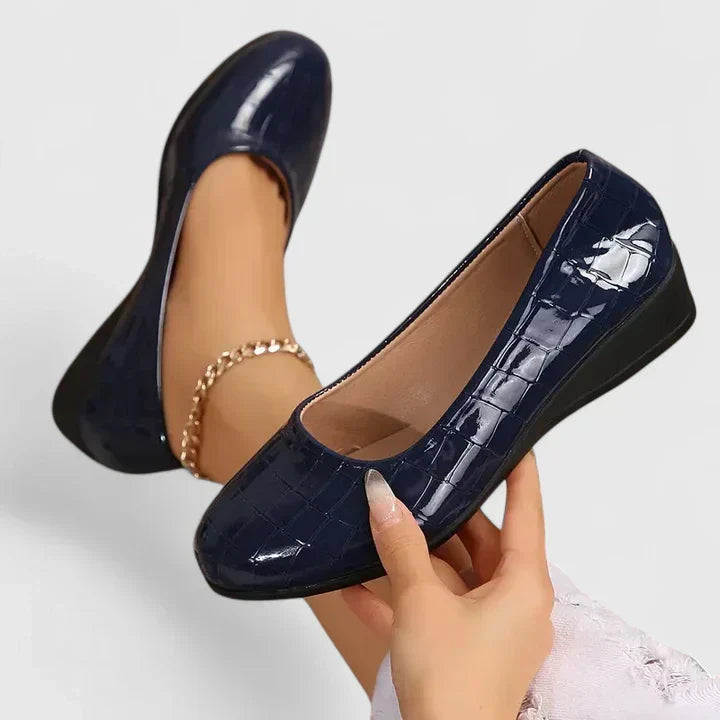 Elegant women's embossed square toe loafers with a comfortable wedge heel. Perfect for office wear or casual chic.