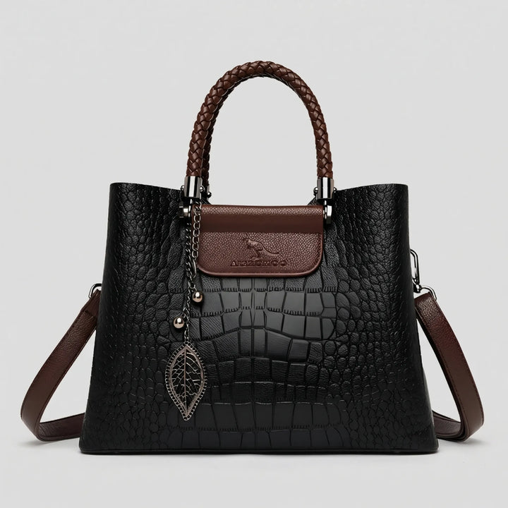 New women's embossed tote bag. Trendy daily shoulder bag with braided handle. A versatile and chic handbag accessory.