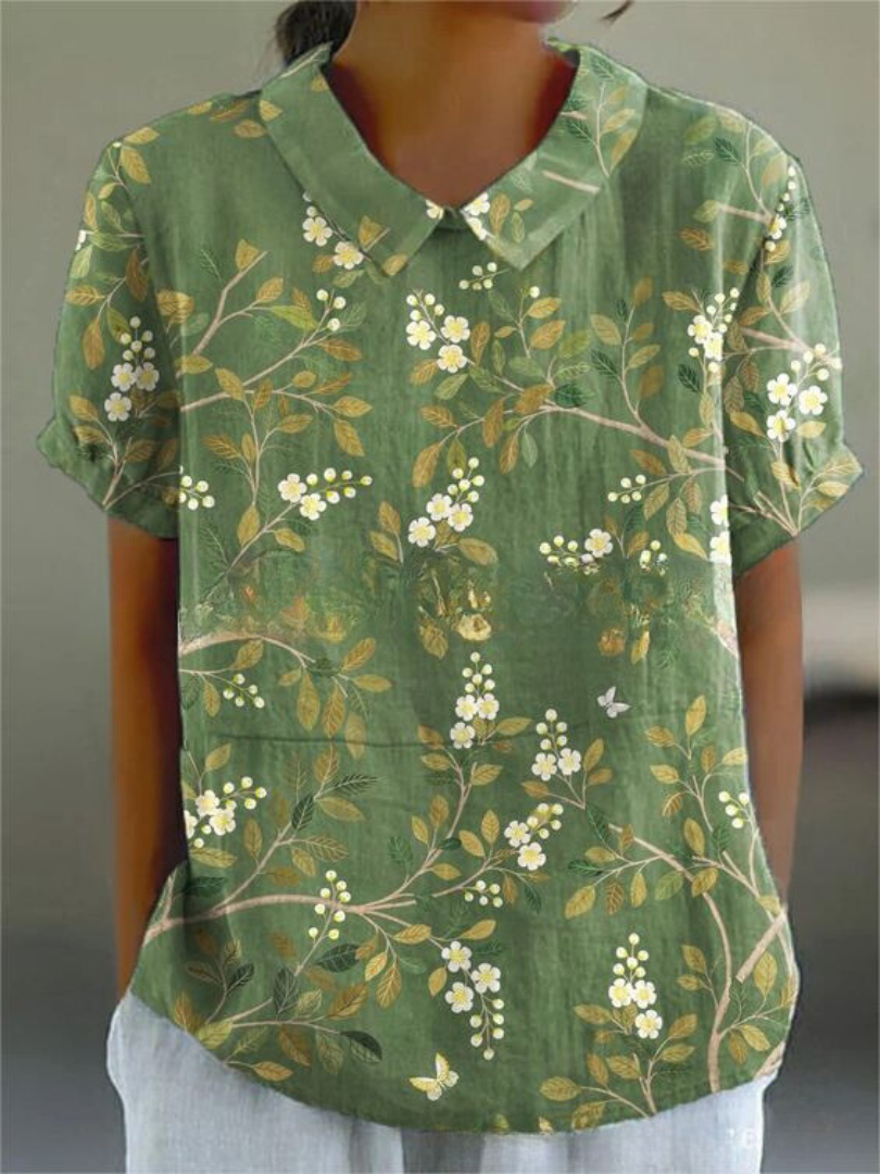 Casual yet elegant short sleeve floral embroidered blouse with Peter Pan collar for summer.