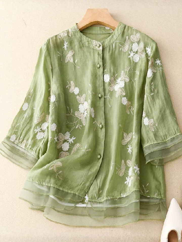 Stylish women's floral embroidered long-sleeve blouse, button-front, versatile casual wear.