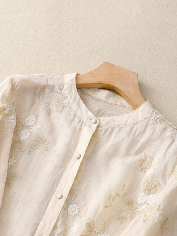 Versatile women's long-sleeve embroidered top, button front, perfect for elegant or casual spring fashion.