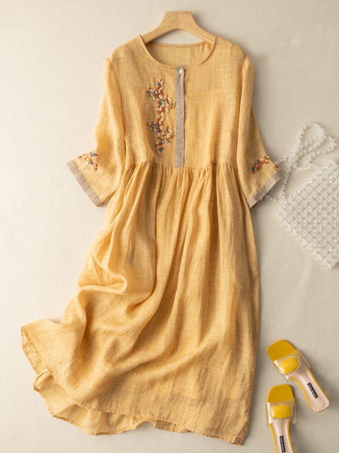Women's embroidered loose fit dress with intricate detailing, perfect for casual summer wear.