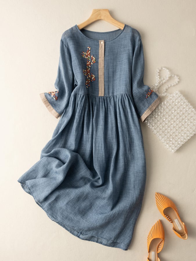 Flowy women's dress with delicate embroidery, a comfortable loose fit for bohemian style.