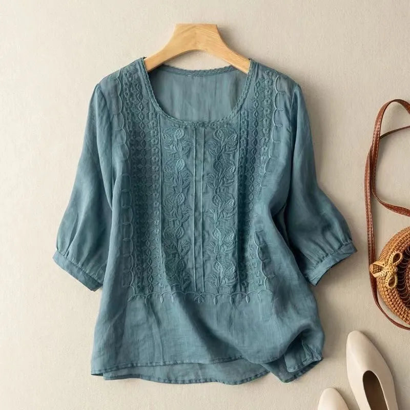 Elegant women's puff sleeve blouse with floral embroidery, perfect for a stylish spring wardrobe.