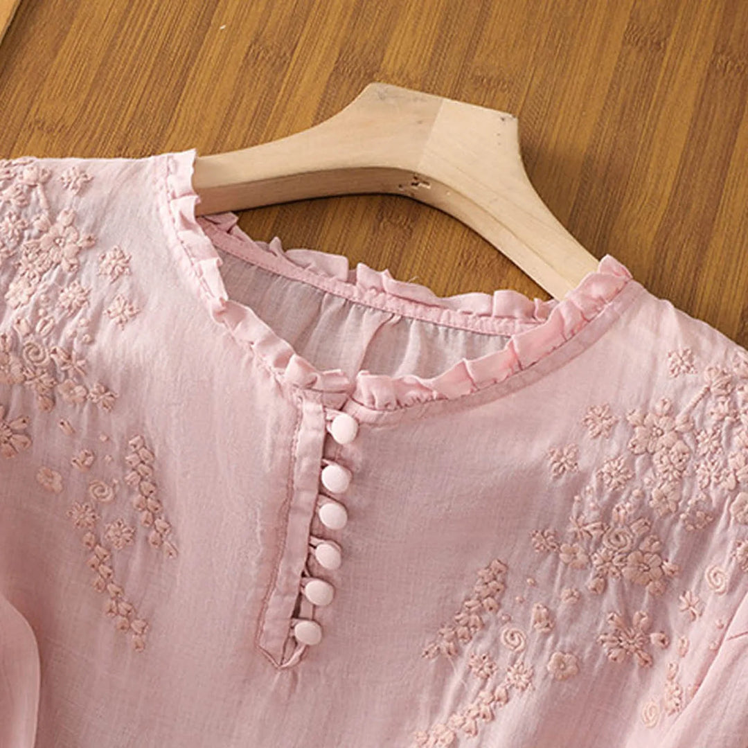 Relaxed fit women's short sleeve blouse with beautiful embroidery, offering a flowy and comfortable summer style.