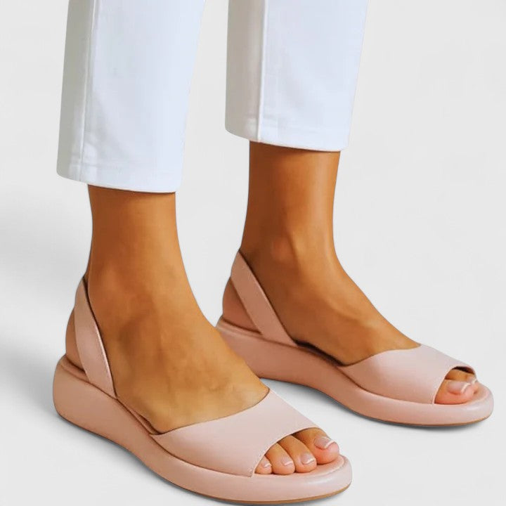 Lightweight Emrynn slip-on sandals, shock-absorbing design for women's all-day comfort.