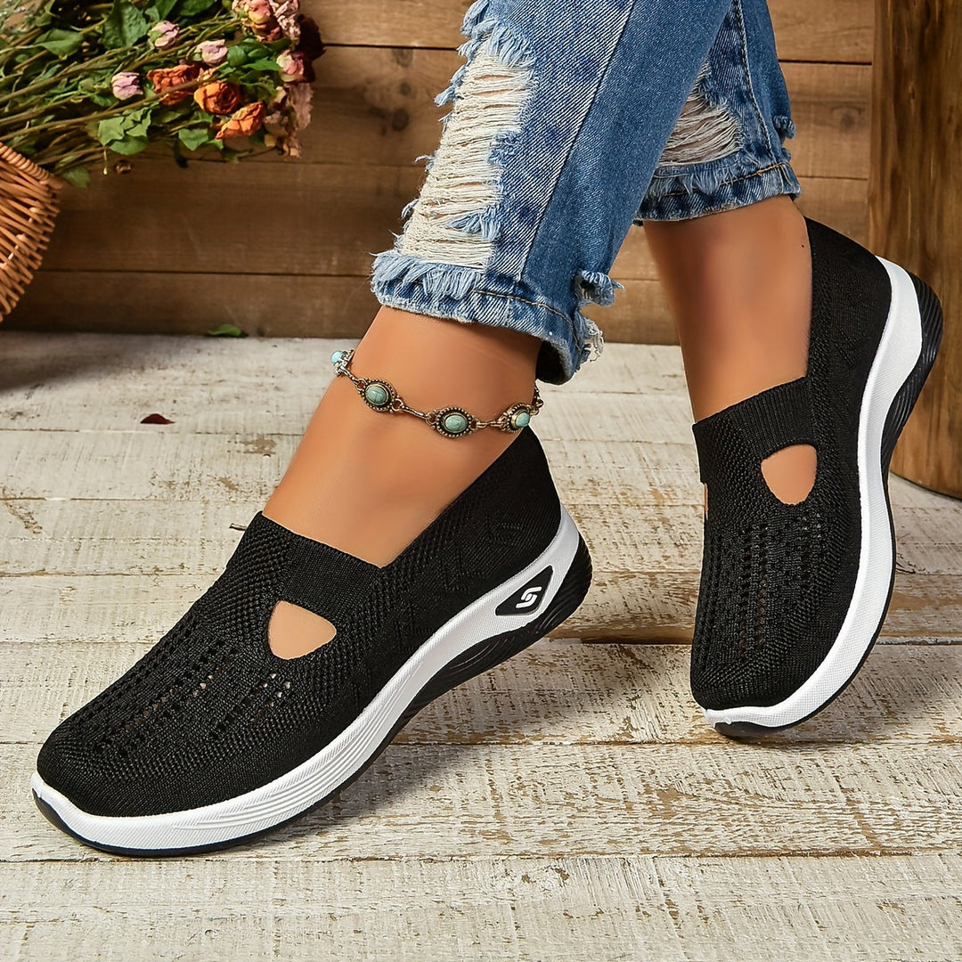Black women's casual slip-on sneakers, lightweight with ergonomic comfort for everyday wear.