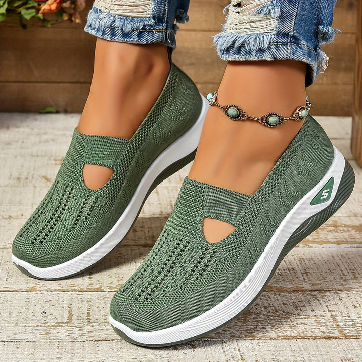 Purple lightweight slip-on sneakers for women, providing ergonomic support and comfort.