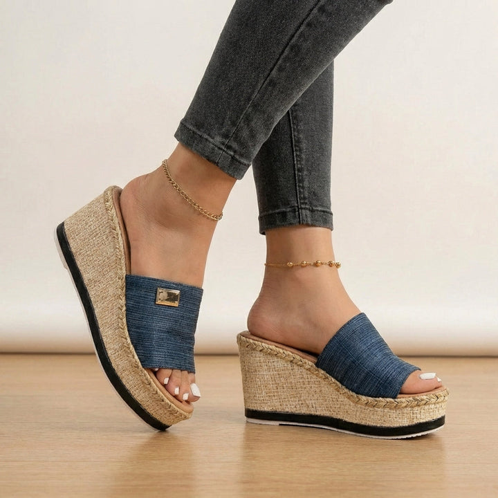 Stylish women's open-toe espadrille wedge sandals, featuring textured straps for comfortable summer fashion.