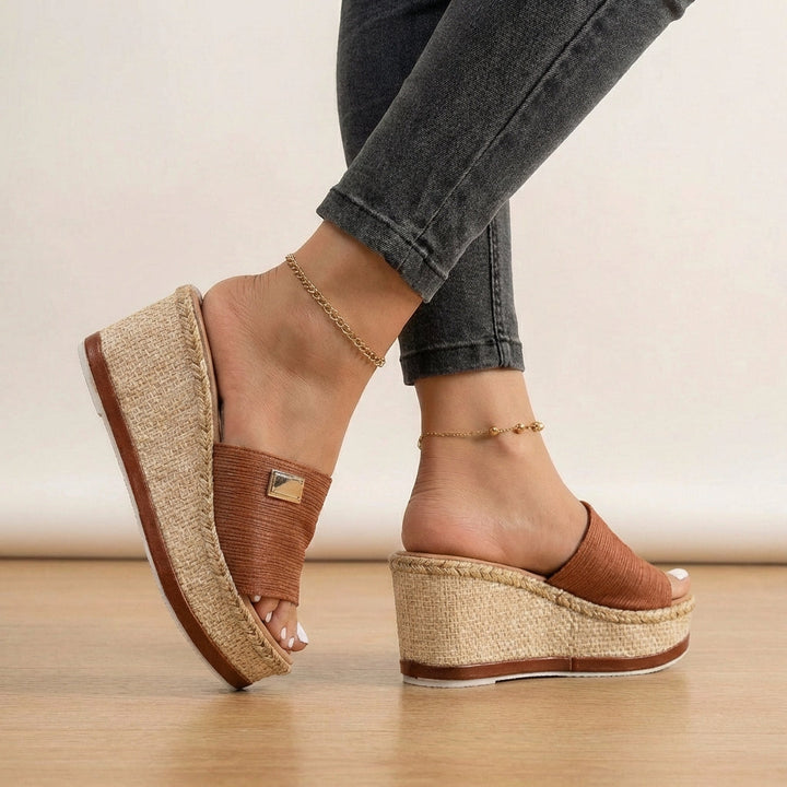 Chic women's espadrille wedge sandals. Textured straps add bohemian flair, ideal for casual summer footwear.