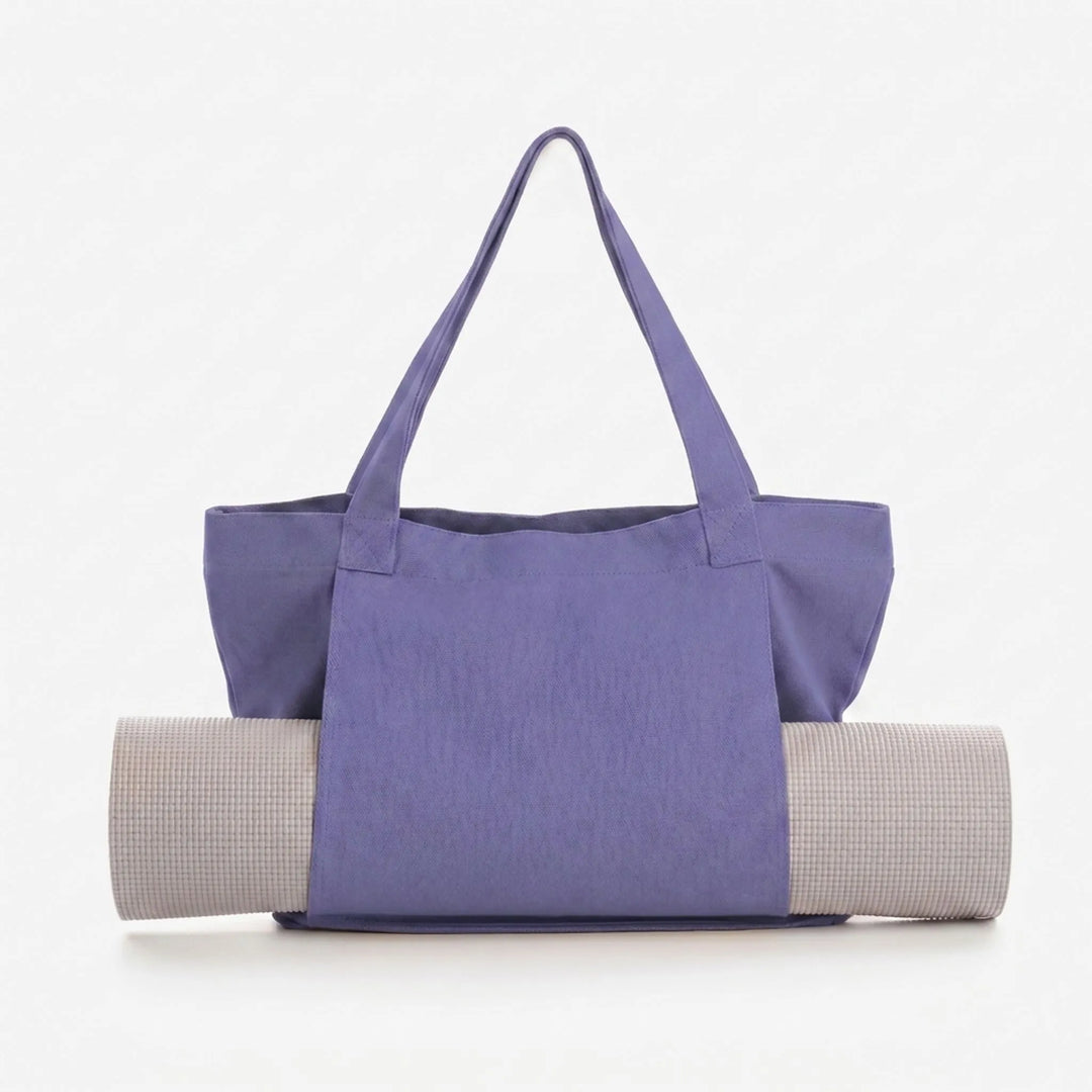 Stylish women's yoga tote bag with integrated mat holder. Ideal for daily fitness, gym, and studio classes.