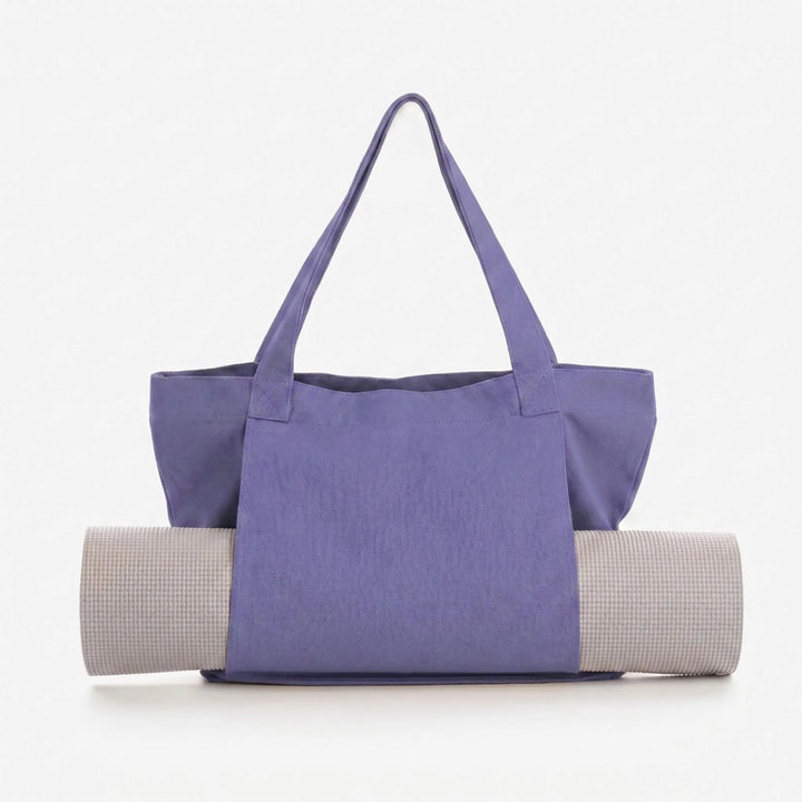 Stylish women's yoga tote bag with integrated mat holder. Ideal for daily fitness, gym, and studio classes.