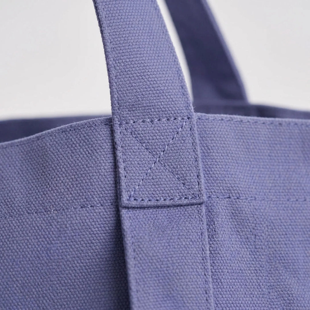 Durable canvas yoga tote bag for women, featuring external mat holder. Versatile daily tote & gym shoulder bag.