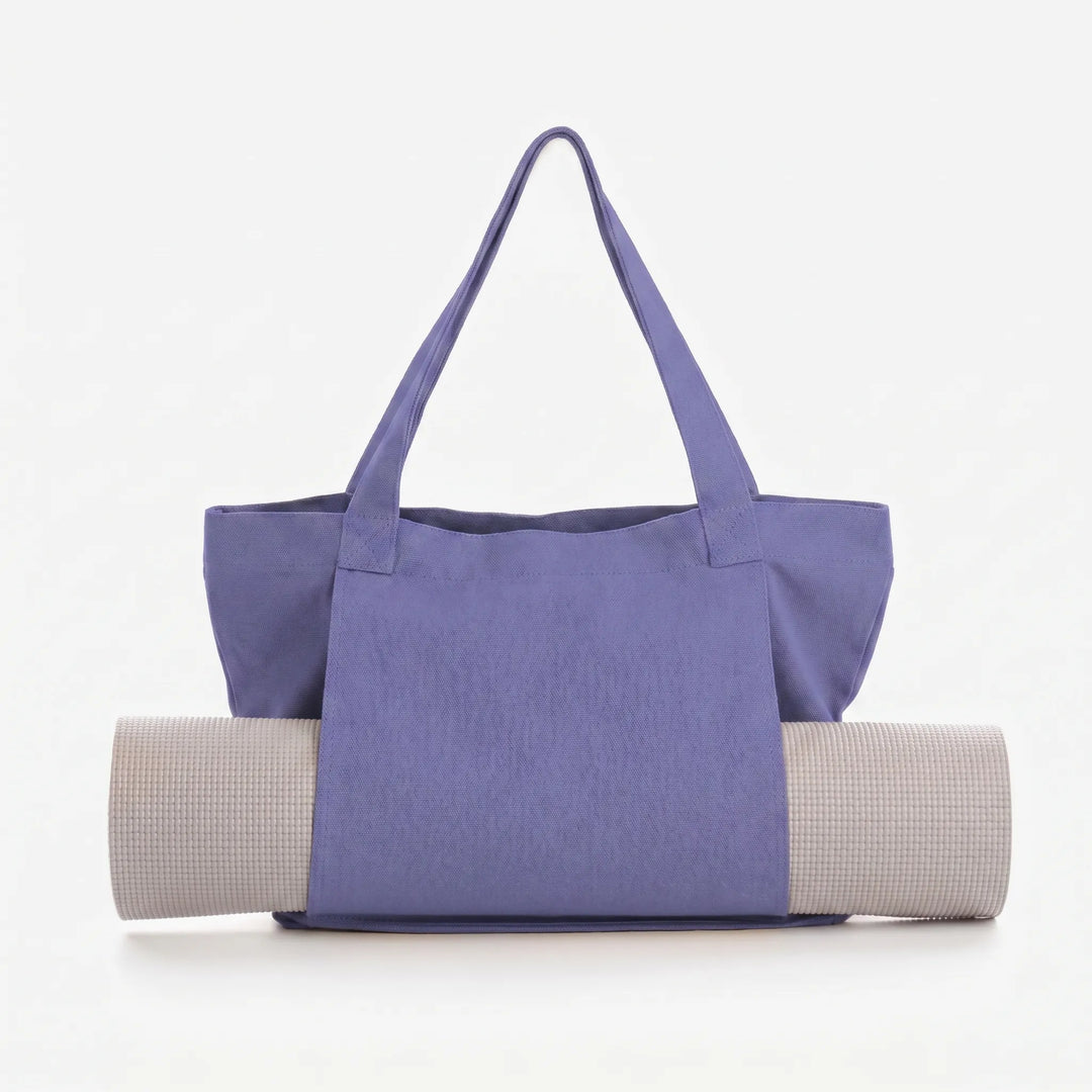 Spacious women's yoga mat bag & gym tote. Convenient activewear accessory with secure yoga mat holder.