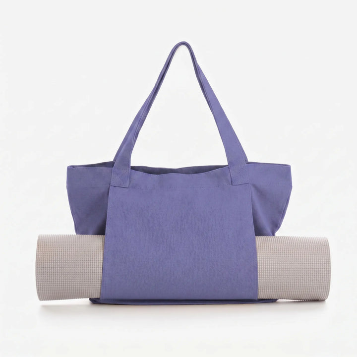 Spacious women's yoga mat bag & gym tote. Convenient activewear accessory with secure yoga mat holder.