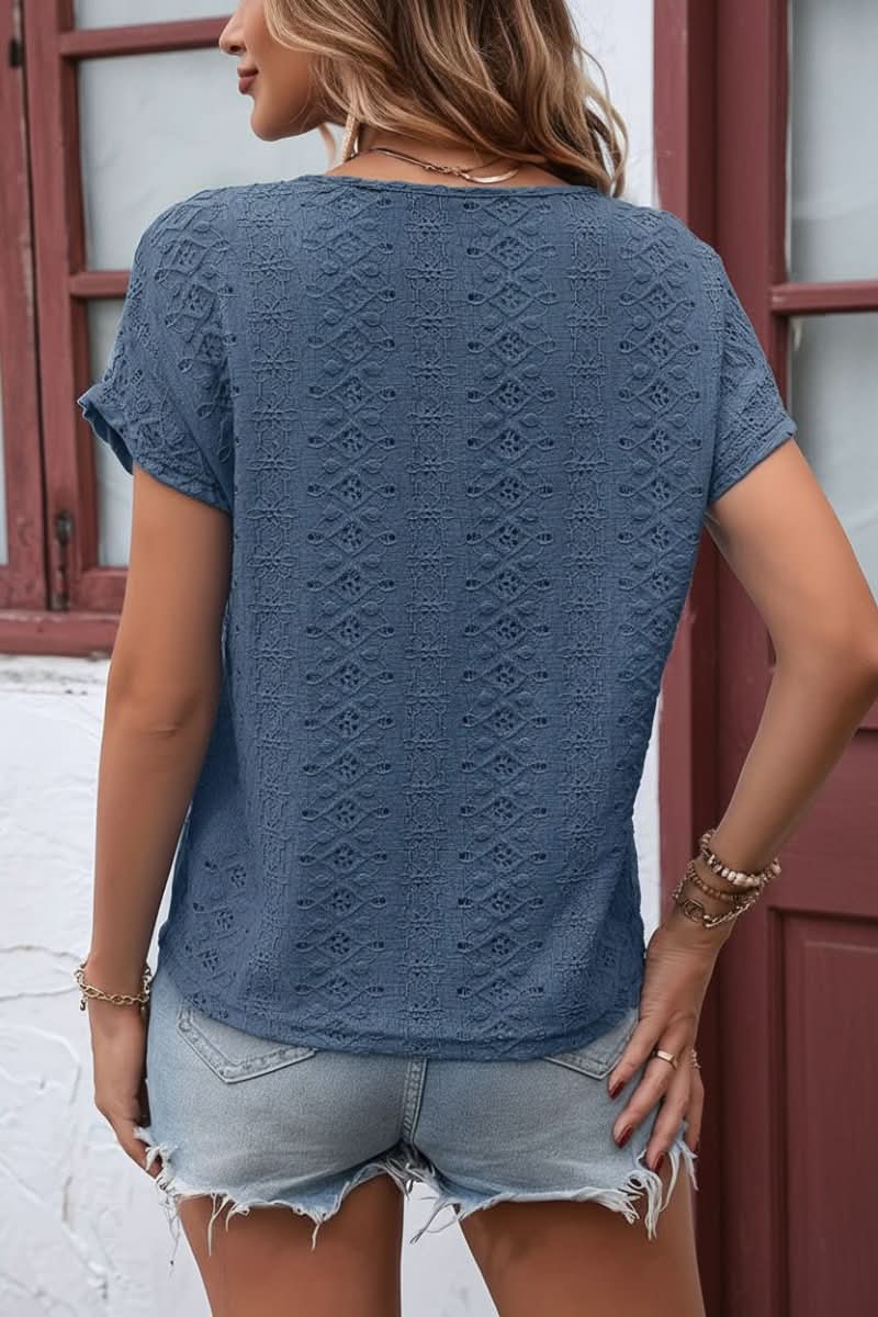 Comfortable short sleeve women's eyelet top, featuring a chic notched neckline for everyday style.