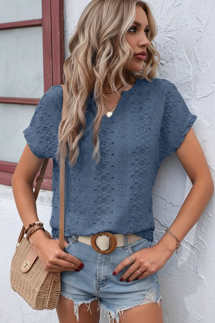 Relaxed fit women's apparel: a comfortable eyelet tee with a fashionable notched neckline.
