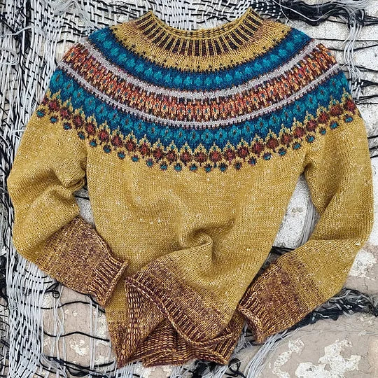 Cozy women's Fair Isle long sleeve crew neck sweater. Relaxed knit for winter, featuring a classic Nordic design.