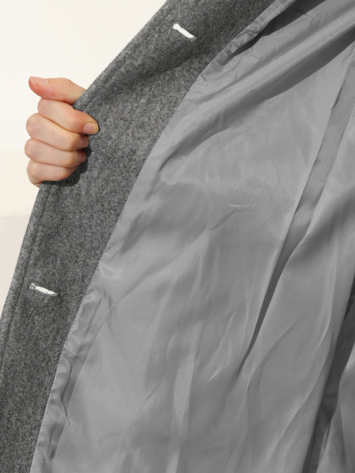 Modern women's trench coat with a sleek fitted silhouette & practical button-up front.