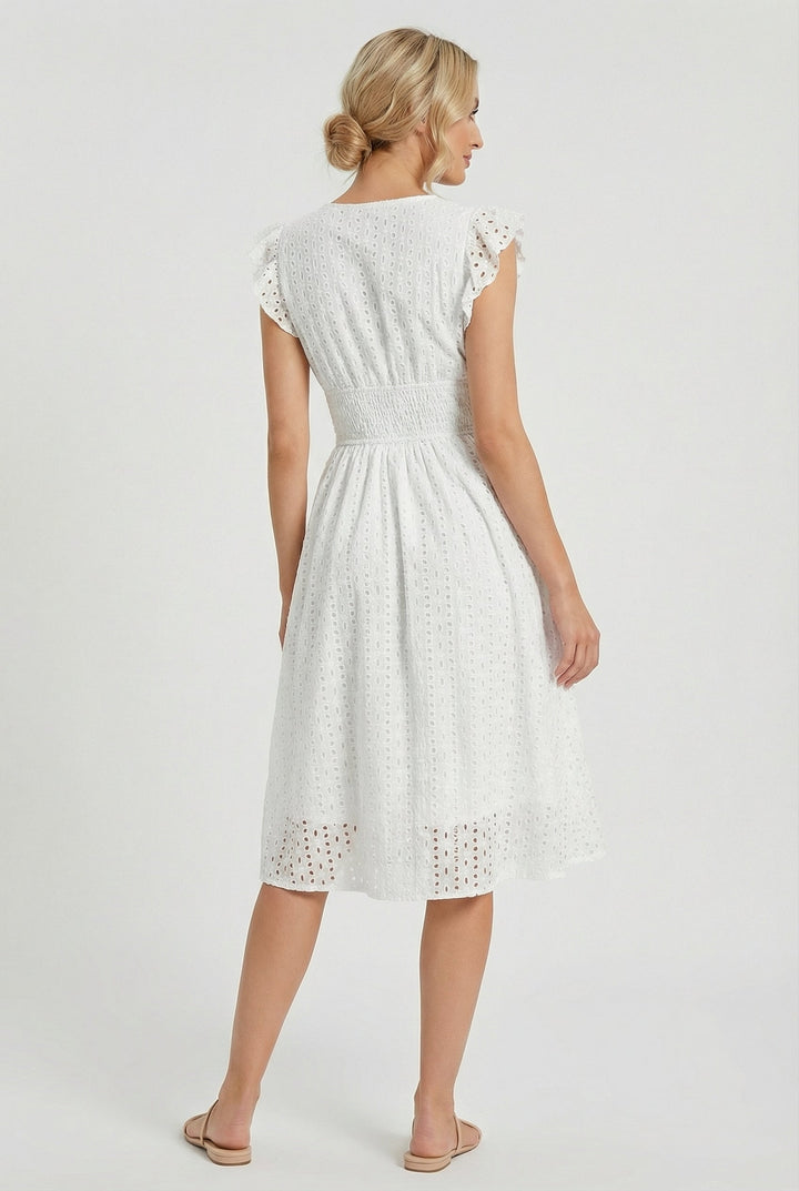 Flowing flared eyelet midi dress for women, featuring delicate ruffled sleeves, ideal for spring & summer.