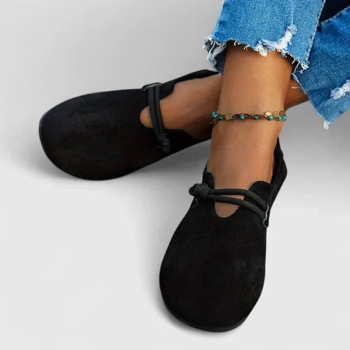 Comfortable women's slip-on flat loafers, featuring stylish rope tie detail, cushioned support & wide fit.