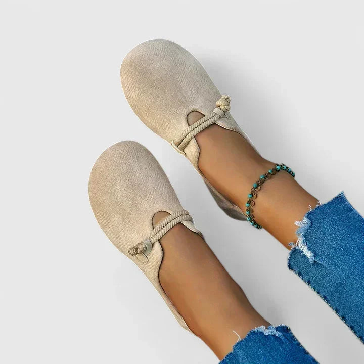 Versatile women's casual flat loafers. Slip-on design with a unique rope tie detail & comfortable rounded toe.