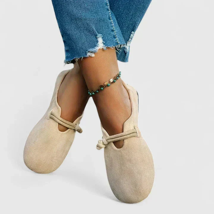 Elegant women's flat loafers with rope tie, offering easy slip-on comfort. Ideal casual footwear for daily wear.