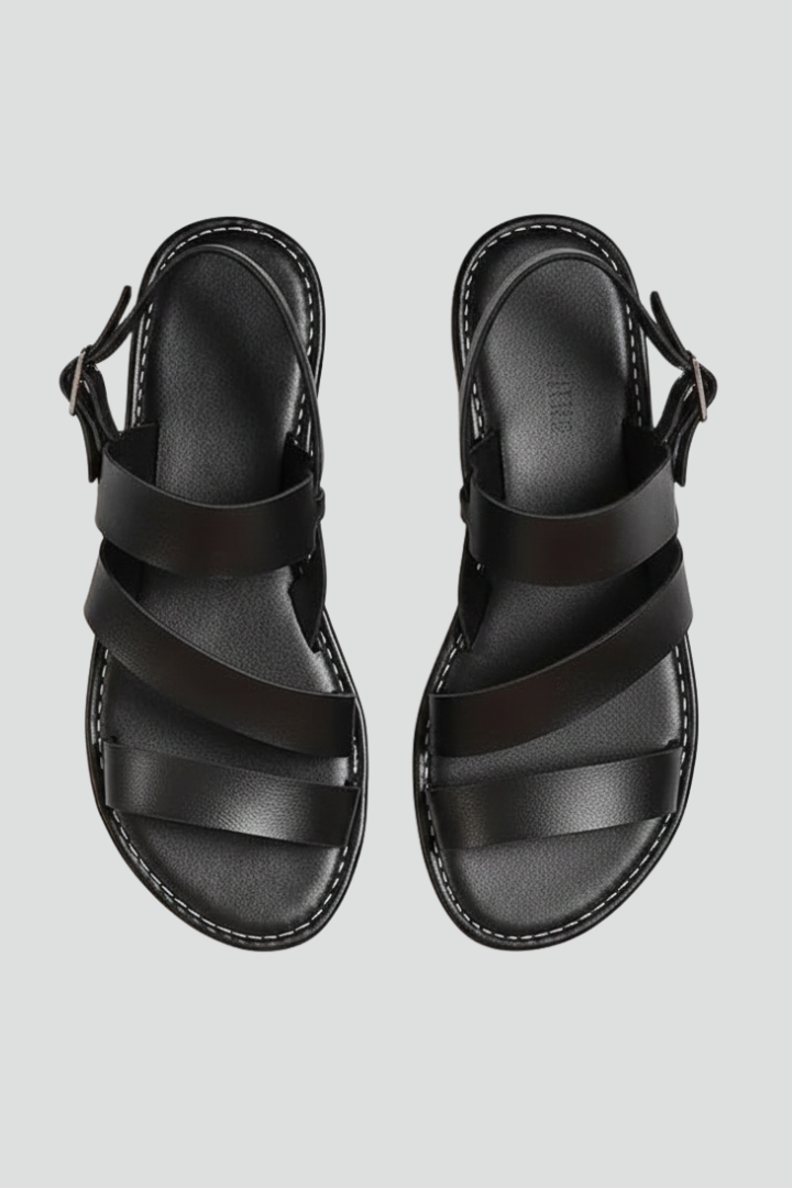 Women's flat sandals with secure back strap, perfect for casual summer wear and everyday style.