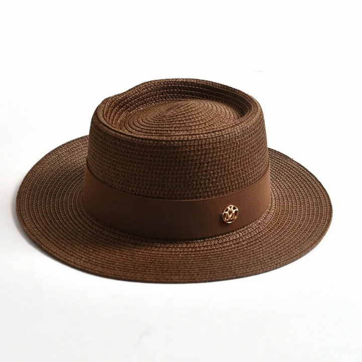 Trendy women's wide brim flat top sun hat, a must-have woven accessory for summer beach fashion.