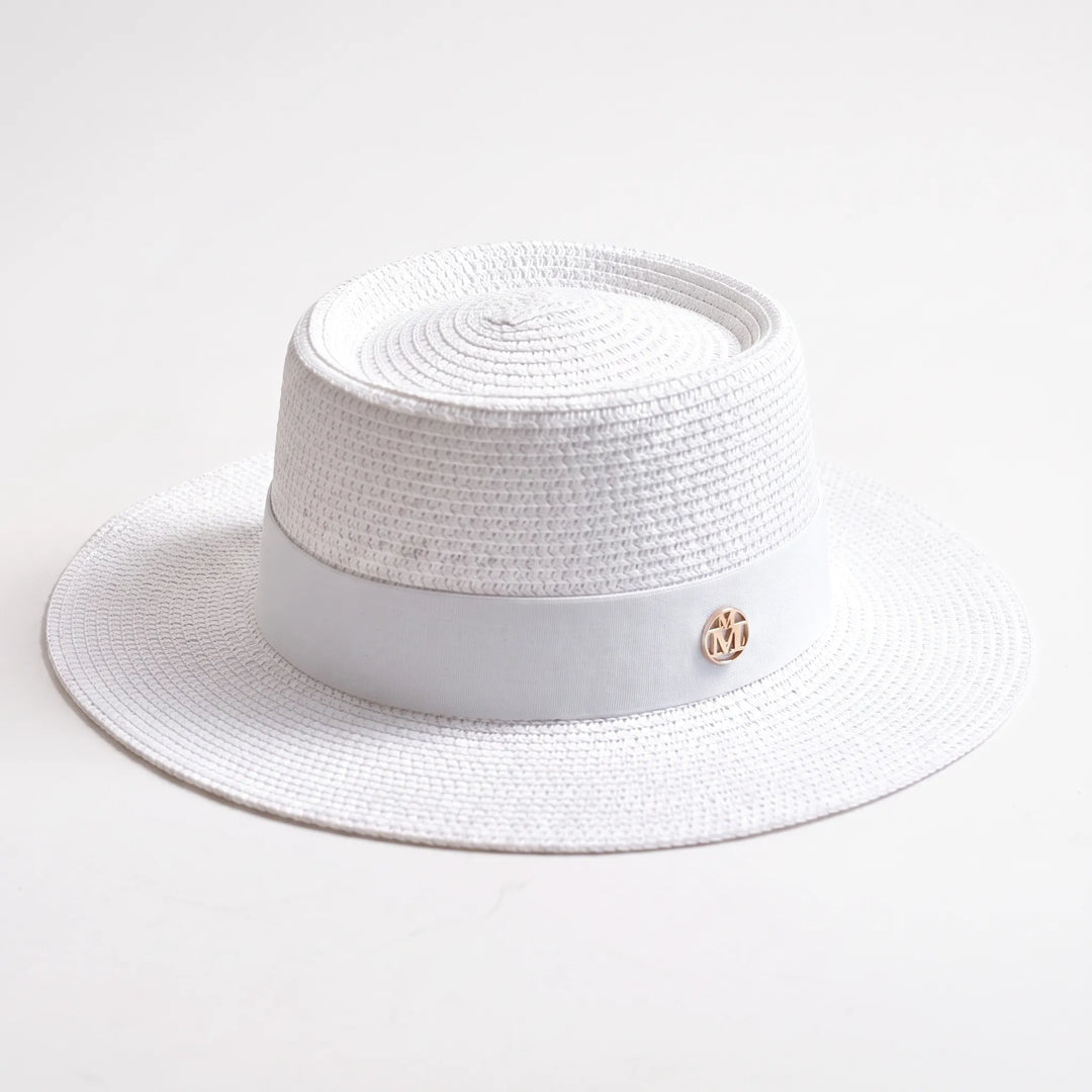 Stylish woven women's flat top sun hat with a wide brim, ideal for excellent summer sun protection.