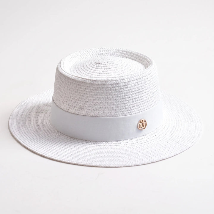 Stylish woven women's flat top sun hat with a wide brim, ideal for excellent summer sun protection.