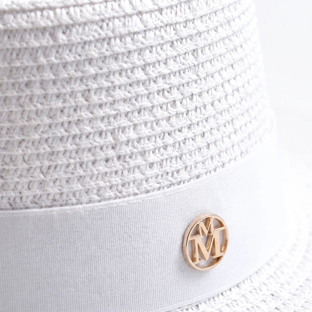 Women's wide brim flat top sun hat, an essential stylish accessory for beach vacations and summer days.