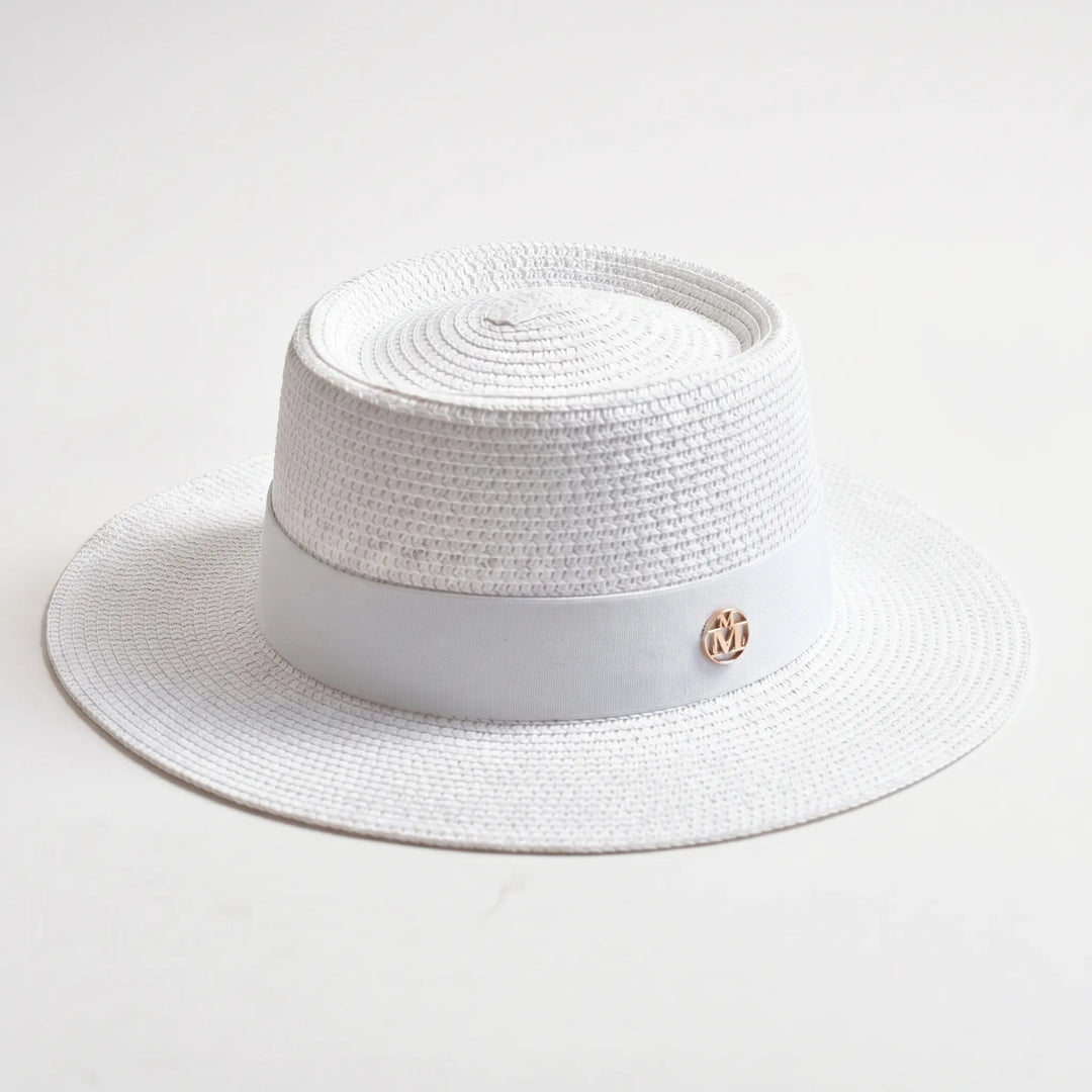 Summer essential: Women's wide brim flat top hat providing chic sun protection for outdoor activities.