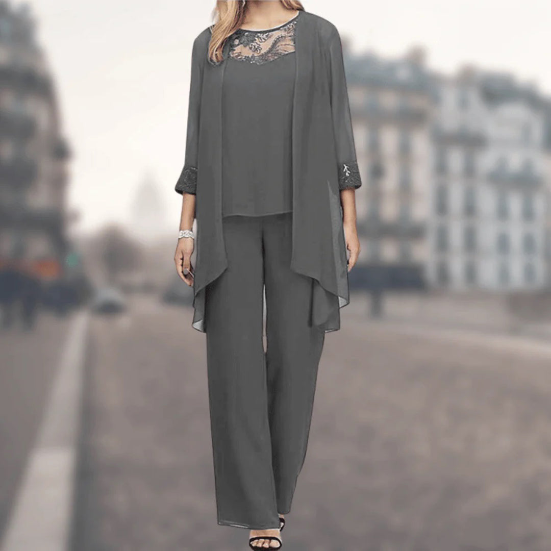 Comfortable women's three-piece lounge set with flowy wide-leg pants, jacket, and delicate lace trim details.