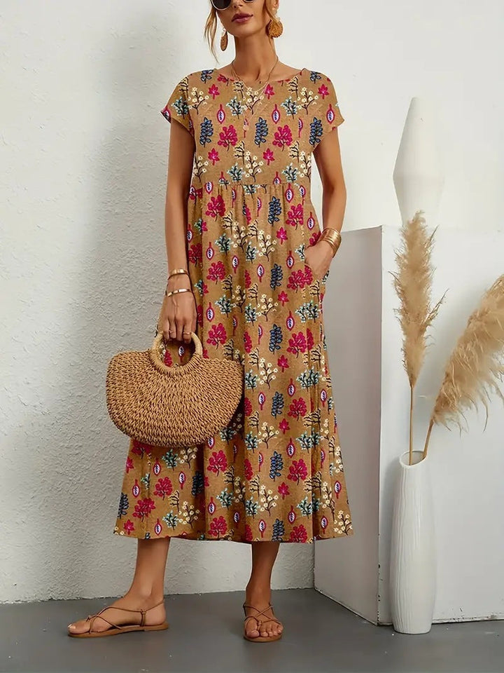 Elegant women's short-sleeve A-line floral dress. Midi length with a comfortable fit, perfect as a versatile day dress.